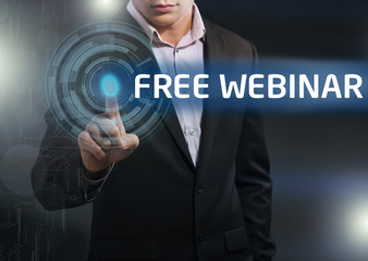 Businessman presses button free webinar on virtual screens. Busi