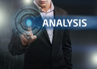 Businessman presses button analysis on virtual screens. Business