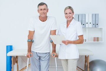 Doctor and patient with crunch looking at camera