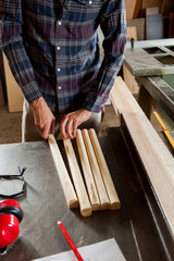Man with pieces of wood