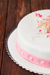 Fondant cake/Flower themed cake on wooden table