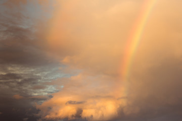 Obraz na płótnie Canvas rainbow with cloudy on sky
