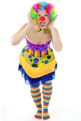 Fototapeta na wymiar Clown in buntem Kostüm und Ringelstrümpfen ist albern und lacht