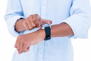 Close up of hipster using his smartwatch