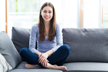 Woman relaxing on sofa