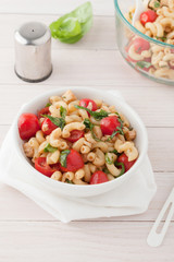 Italian macaroni salad with tomatoes and fresh basil