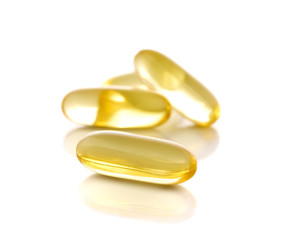 fish oil capsules on white background