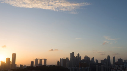 Obraz na płótnie Canvas Silhouette Cityscape of Singapore at sunrise