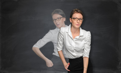 Woman tanding near the blackboard