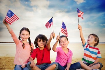 Composite image of children with american flags