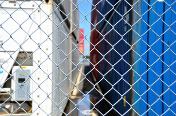 Wire mesh fence enclosing the container yard