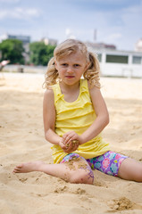 child playing with sand