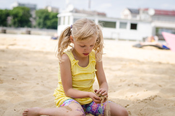 child playing with sand