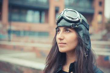 aviator young beautiful brunette woman with cap and glasses