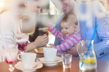 Fototapeta premium Young parents with their daughter