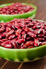 kidney bean in ceramic bowl on wooden board