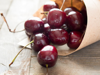 Fresh cherries on a wooden table in a kitchen