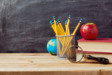 Back to school background with teachers objects over chalkboard