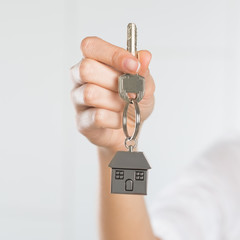 Woman holding key of her new house