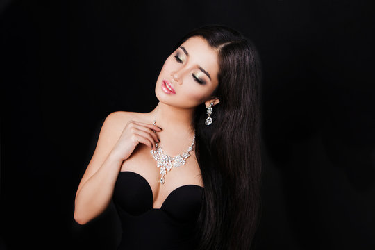 beautiful young asian woman posing with jewelry