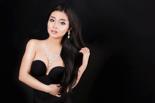 beautiful young asian woman posing with jewelry