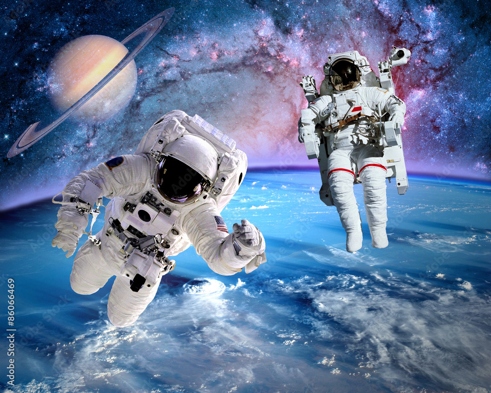 Wall mural astronaut spaceman outer space saturn planet earth universe. elements of this image furnished by nas