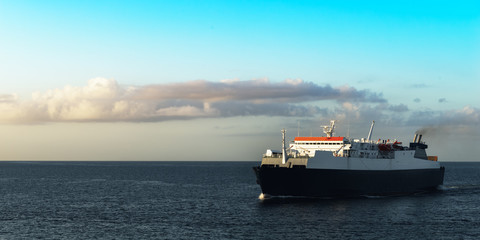 Ferry boat transporting passengers sailing sunrise in Trinidad and Tobago 