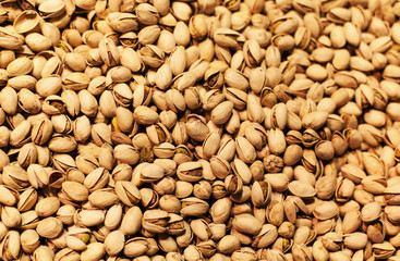 Pistachios background on a market stall close-up. Food healthy b
