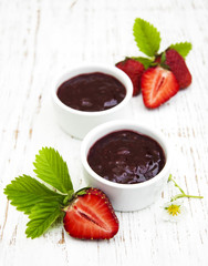 Strawberry jam and fresh strawberries