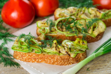 Bruschetta with grilled zucchini.  Soft focus
