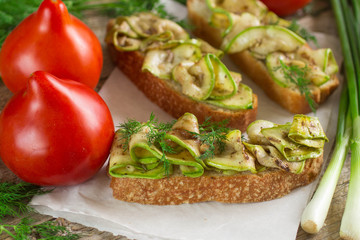 Bruschetta with grilled zucchini.  Soft focus