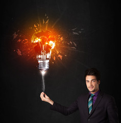 Businessman with an explosion bulb