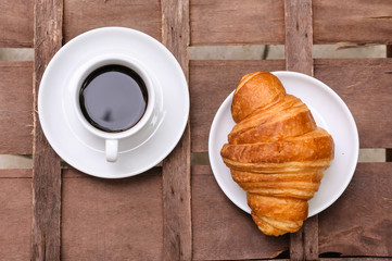 cup of coffee with croissant