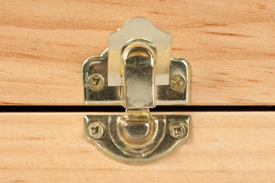 Macro detail of a wooden box metal latch