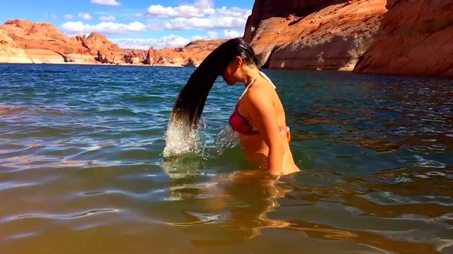 Bikini Woman taking a relaxing bath in the Lake Powell Utah