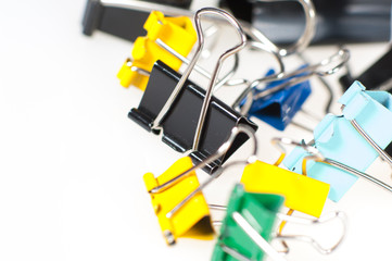 Colorful paper clips on white background