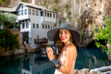 Fototapeta premium Woman photographing in Blagaj village