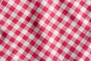 Red picnic tablecloth background. Red and white fabric texture.