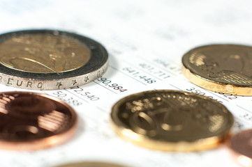 Coins on financial report