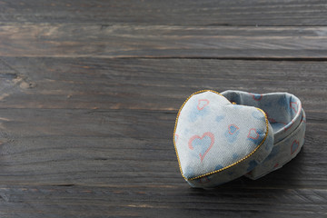 Heart shaped Valentines Day gift box on wood