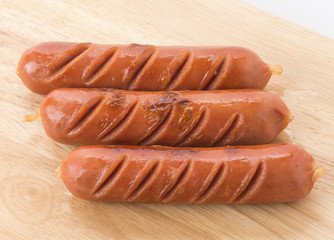 grill sausage on wood board