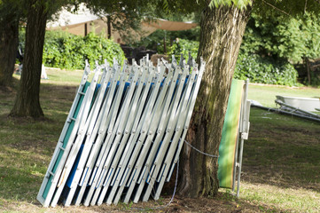 empty sunbeds in line at the lake