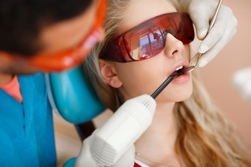 Woman patient at dentist dental clinic teeth care