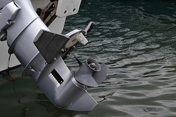 Small screw-proppeller on motor boat in raised position
