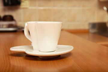 Empty tea coffee cup mug on saucer. Heart shape.