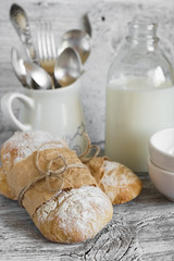 homemade rustic bread on a light wooden surface