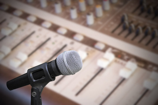 Microphone on sound mixer background