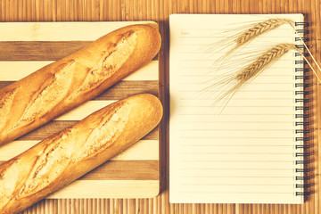 Baguettes and notebook on the table