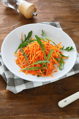 Vitamin salad of grated carrot and arugula