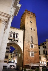 Fototapeta na wymiar ancient bell tower in the Herbs Square in Italy